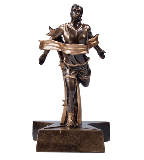 Bronze female athletics figure on a star base, molded from resin as one unit.